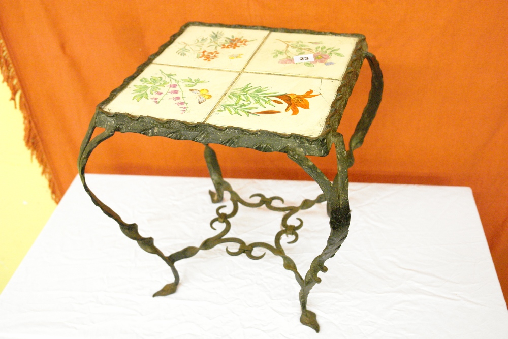 INTERESTING CAST IRON LOW TABLE WITH FOUR TILES TO THE TOP WITH FLORAL DECORATION