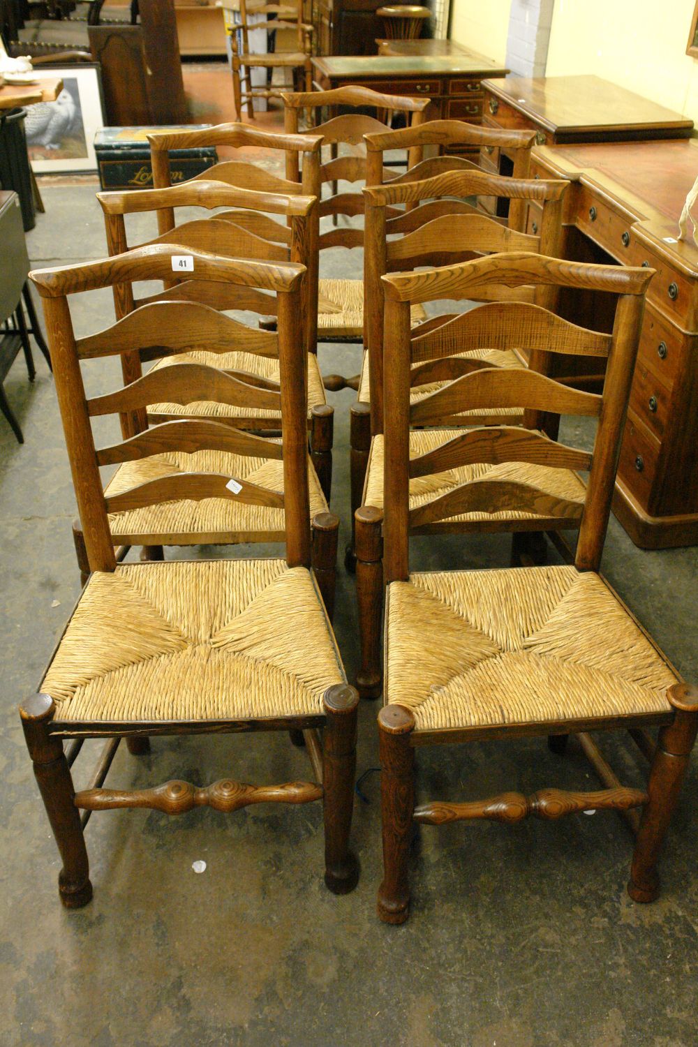 SEVEN EARLY 19THC ASH AND ELM DERBYSHIRE STYLE LADDER BACK CHAIRS