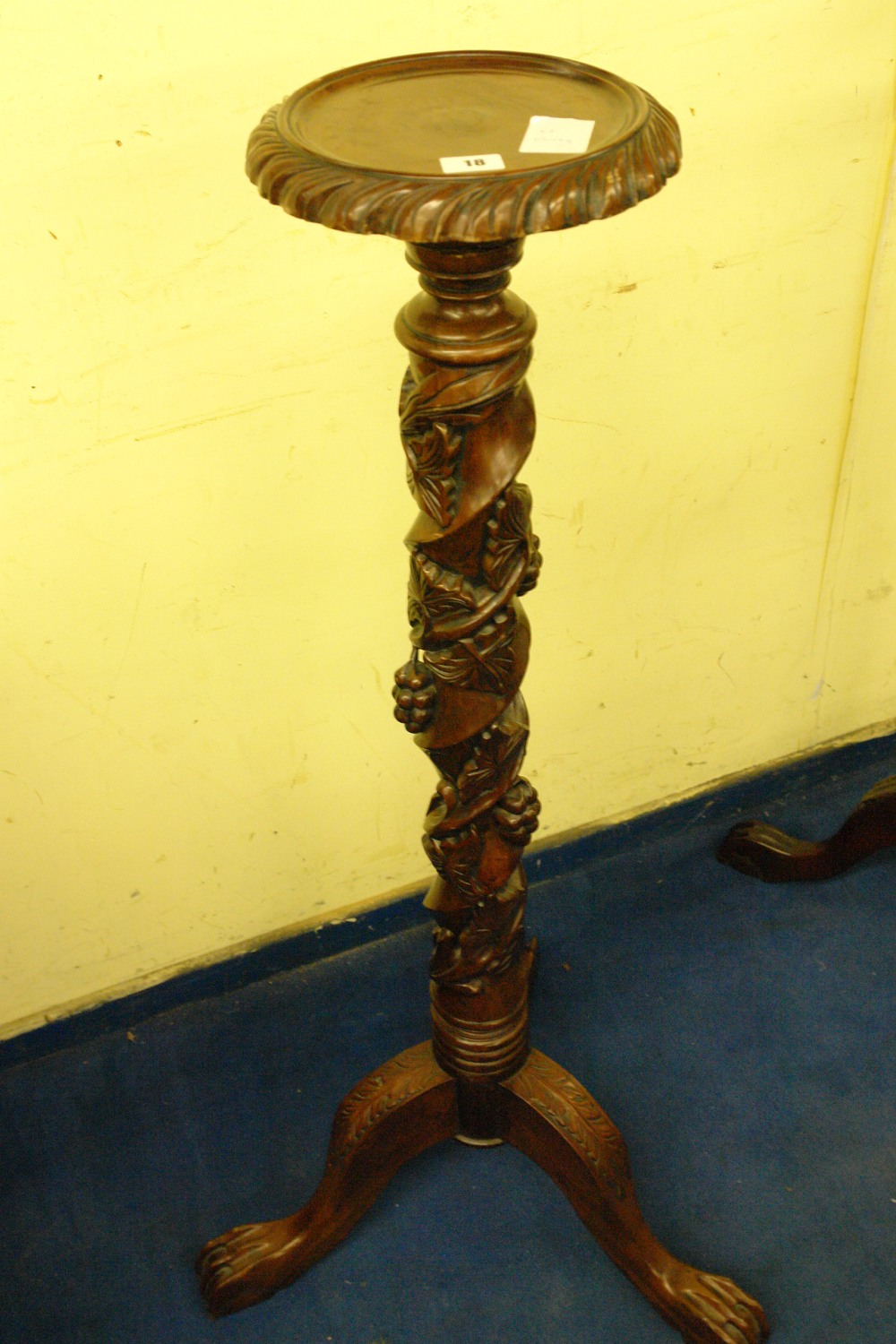 20THC REPRODUCTION HARDWOOD PROFUSELY CARVED TRIPOD TORCHERE DECORATED WITH ENTWINNED GRAPES AND