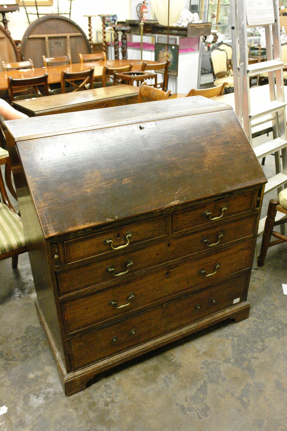 GEORGE III OAK MAHOGANY CROSS BANDED BUREAU FITTED WITH 2SHORT OVER 3 DRAWERS ON BRACKET FEET (SPLIT