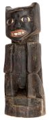 An American Pacific-Northwest carved wooden totemic figure, the eyes and mouth painted. 50cms