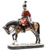 A Michael Sutty porcelain figure of a mounted officer ?18th Bengal Lancers? in full dress with