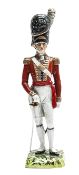 A well modelled Dresden porcelain figure ?Officer 1815 Foot Guards?, in full dress, at ease, his