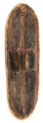 A rare Australian Aboriginal wooden shield, of elongated oval shape, 26? x9?, the domed front with