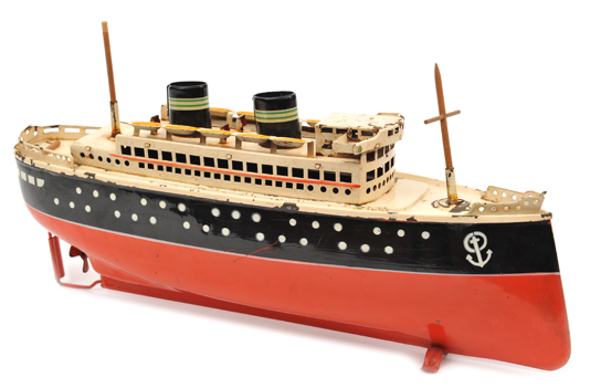 A rare 1930?s Arnold clockwork Ocean Liner. 33cm long, 13.5cm to top of funnel, painted in red,