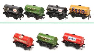 7 Hornby Dublo 2/3-rail tank wagons. 2x ?Power Petrol?, 2x ?Esso? (black tank), ?Esso? (buff tank),