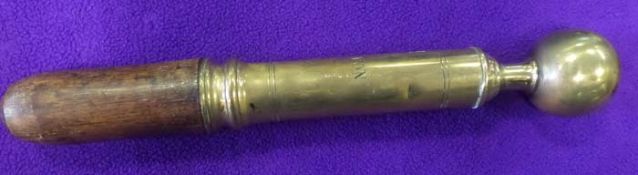 A heavy brass tipstave, 13? overall including short wooden handle, the cylindrical half engraved ?