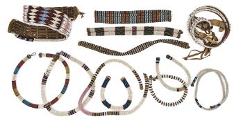 A quantity of Zulu beadwork: twelve heavy belts, some with brass stud fastenings, probably mid