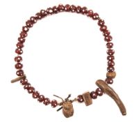 A large 19th Century Zulu charm necklace, diameter 7” consisting of early trade beads (brown with
