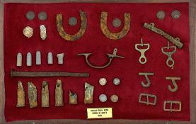 An old framed display of battlefield artefacts, labelled “Anglo-Zulu War Rorke’s Drift 1879”,