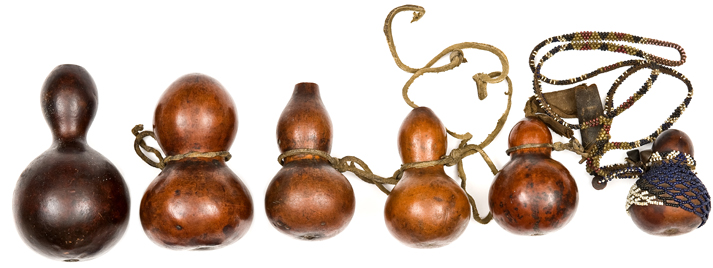 Six Zulu or other Southern African gourds for snuff or medicine, one decorated with old beadwork and
