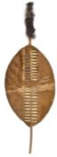 A Zulu personal War shield, ihawu, 26” x 15½”, brown hide with red and black lacing, orignal