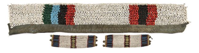 A Zulu married woman’s very heavy old belt, of canvas with panels of large red, black and white