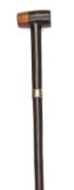 A Zulu two tone hardwood staff with mallet shaped end, bearing a hallmarked silver band engraved “