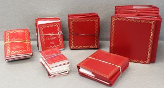 A LARGE QUANTITY OF ASSORTED CARTIER WRIST WATCH BOOKLETS, WALLETS, WARRANTY BOOKLETS ETC.