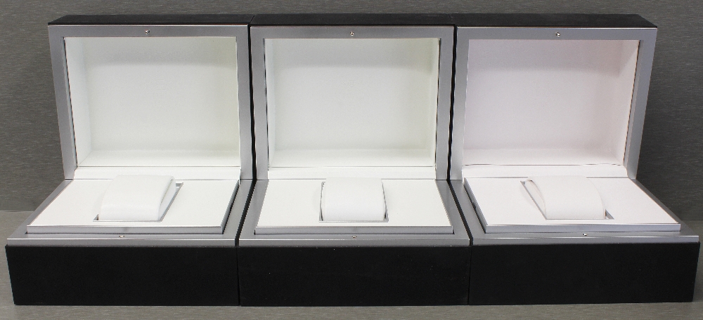 THREE IWC WRIST WATCH BOXES CIRCA 2000s Black boxes with white interiors and watch holders. No