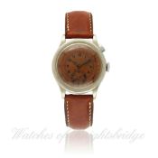 A GENTLEMAN`S SINGLE BUTTON "FLYBACK" CHRONOGRAPH WRISTWATCH CIRCA 1940`s D: Copper colour dial with