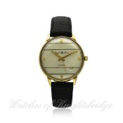 A GENTLEMAN`S 18K SOLID GOLD PAUL BUHRE WRISTWATCH CIRCA 1970, REF. 235 1 D: Silver dial with gilt