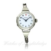 A LADIES SOLID SILVER ROLEX BRACELET WATCH CIRCA 1920 D: White enamel dial with applied Roman