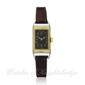 A RARE LADIES STEEL & SOLID GOLD REVERSO WRISTWATCH CIRCA 1930s D: Gloss black dial with applied