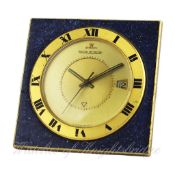 A GILT METAL LACQUERED JAEGER LECOULTRE ALARM TRAVEL CLOCK CIRCA 1970 D: Two piece champagne dial,