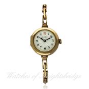 A LADIES 9CT SOLID GOLD ROLEX BRACELET WATCH CIRCA 1920s D: White enamel dial with applied Arabic