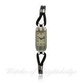 A LADIES STAINLESS STEEL JAEGER LECOULTRE WRIST WATCH CIRCA 1930s D: Silver dial with applied Arabic