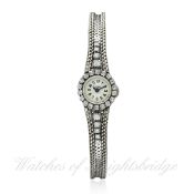 A FINE & RARE LADIES 18K SOLID WHITE GOLD & DIAMOND CARTIER BACK WIND BRACELET WATCH CIRCA 1950s,