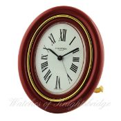 A RARE CARTIER PARIS BAIGNOIRE PENDULETTE ALARM DESK CLOCK CIRCA 1980, REF. 7509 WITH CARTIER