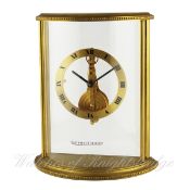 A GILT METAL JAEGER LECOULTRE DESK CLOCK CIRCA 1970s D: Gilt dial with applied Roman numerals. M: