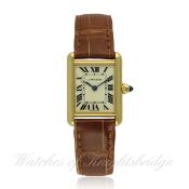 A LADIES 18K SOLID GOLD CARTIER TANK WRIST WATCH CIRCA 2000s, REF. 2442 D: Silver dial with