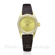 A LADIES 14K SOLID GOLD & DIAMOND ROLEX OYSTER PERPETUAL WRIST WATCH CIRCA 1986, REF. 67187 D: