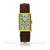 A GENTLEMAN`S 18K SOLID GOLD ROLEX RECTANGULAR WRIST WATCH CIRCA 1930s D: Silver dial with applied