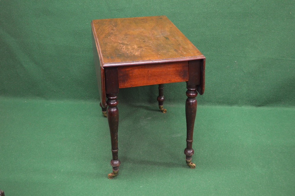 A Victorian mahogany Pembroke table the top having moulded edge and two drop flaps with rounded