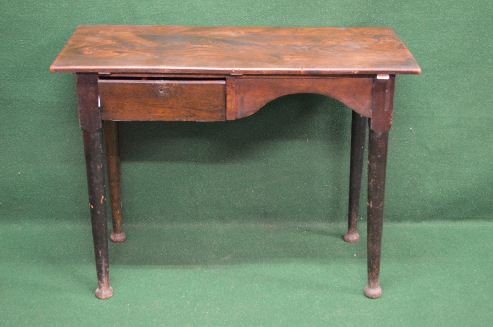 An elm top writing table having right hand side kneehole and drop down flap left hand side opening