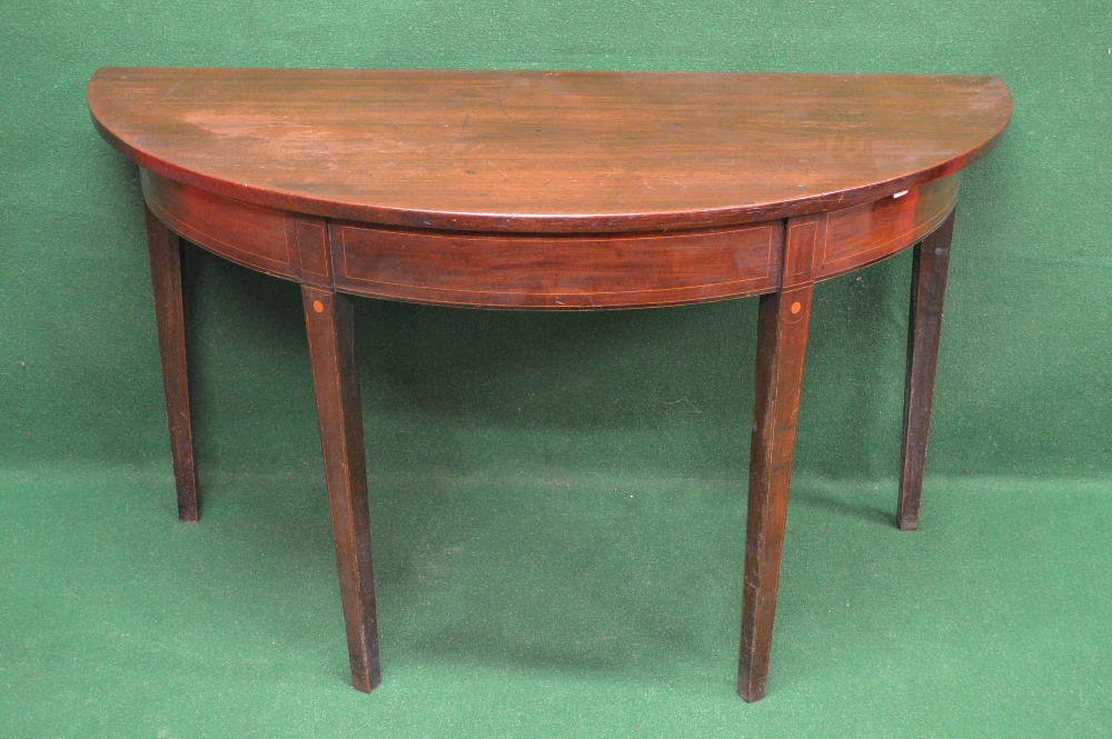 A mahogany demi lune side table having string inlaid decorated frieze and standing on square