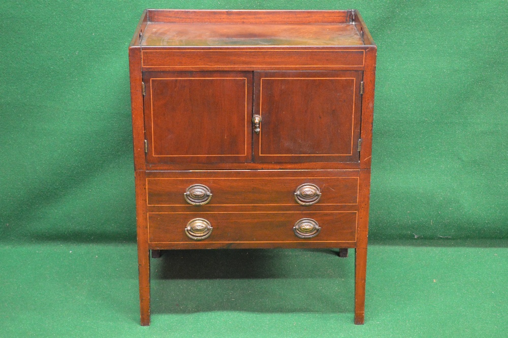 A mahogany string inlaid night stand having raised gallery with pierced handles over two doors and