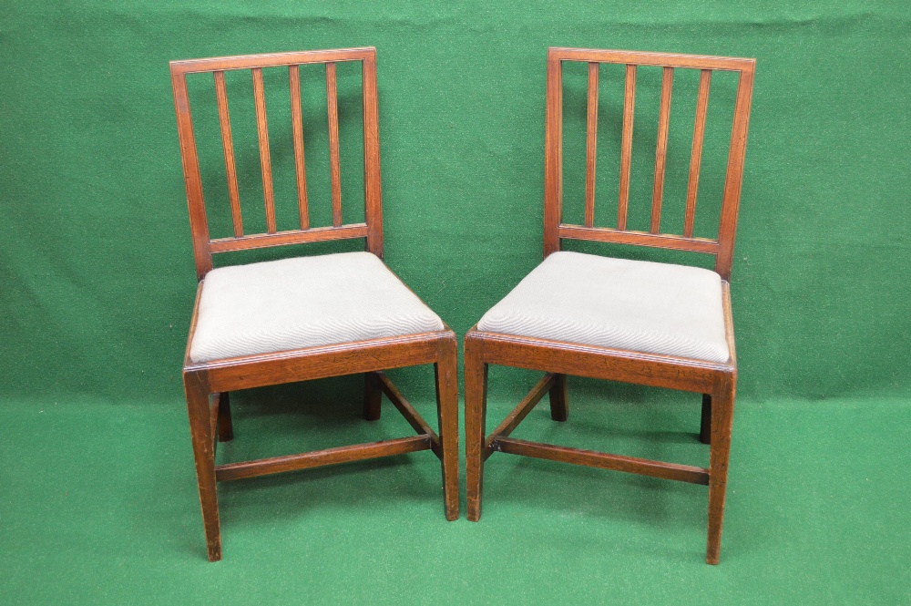 A set of five mahogany dining chairs having moulded top rail supported by two moulded uprights and