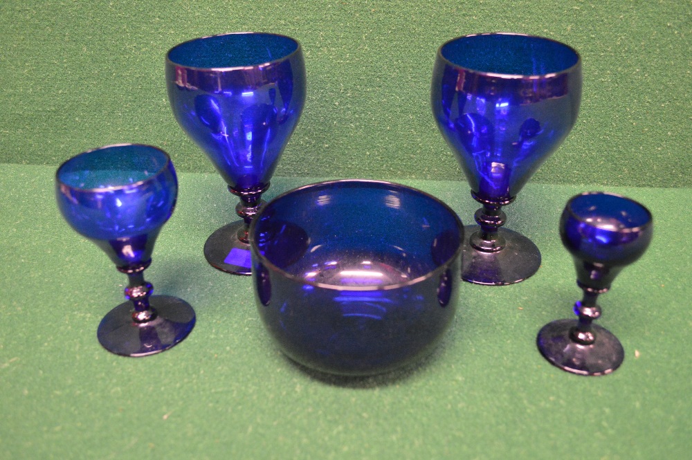 A group of five pieces of blue glassware to comprise: pair of rummer glasses, sherry glass,