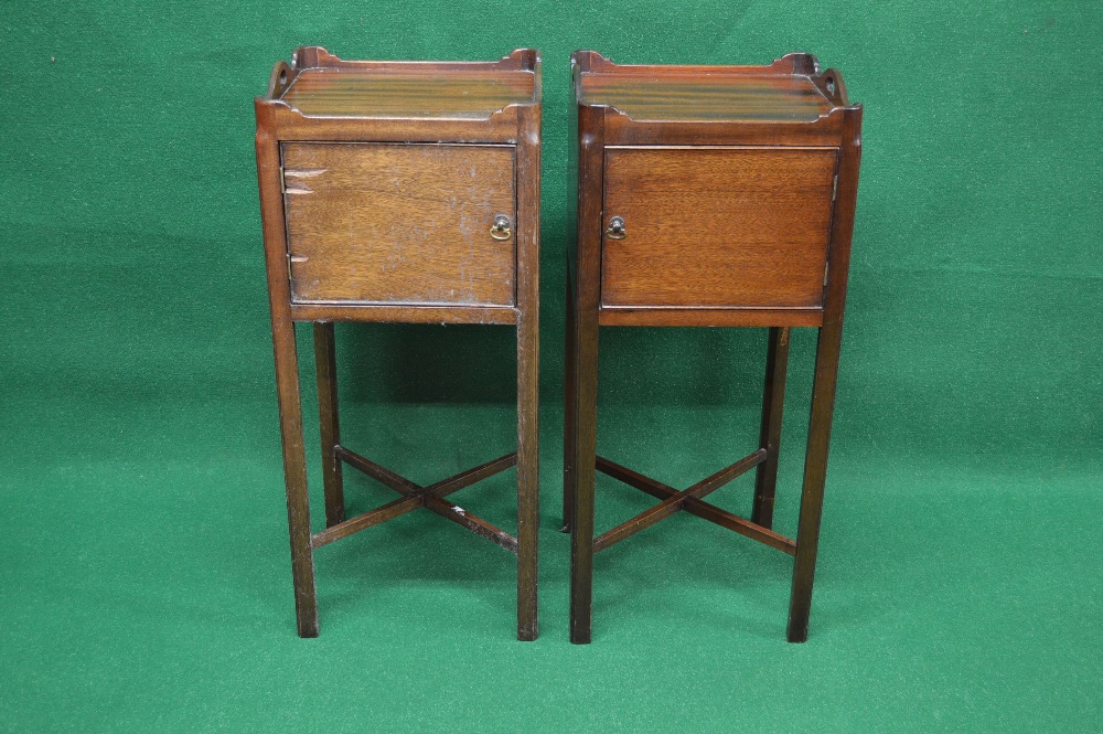 A pair of 20th century mahogany tray top bedside tables having raised gallery and single opening