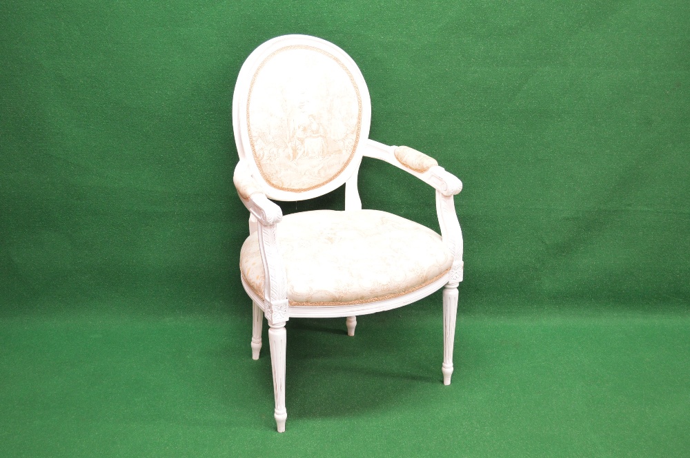 A Louis style painted open armchair having upholstered back, arms and seat and standing on