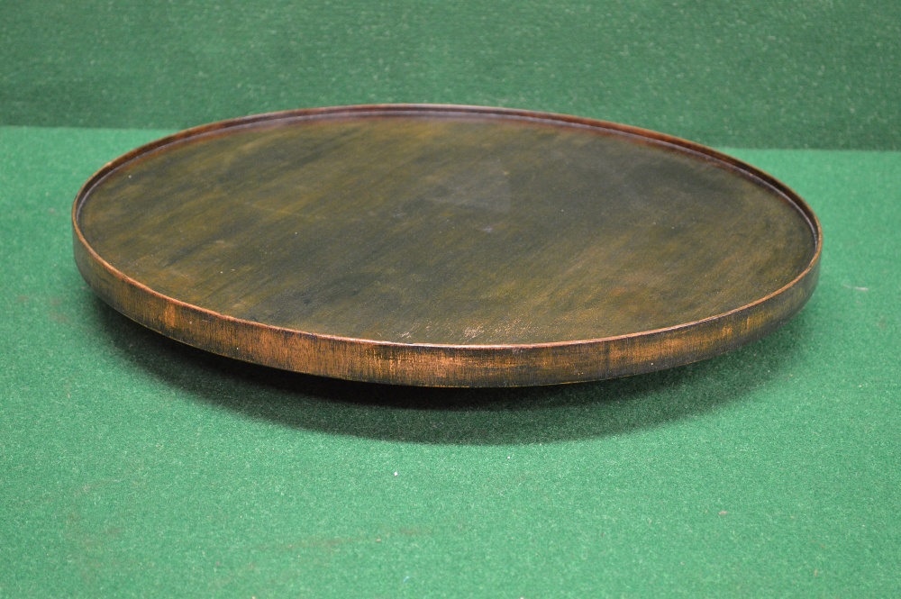 A circular mahogany Lazy Susan standing on circular base - 20" in dia