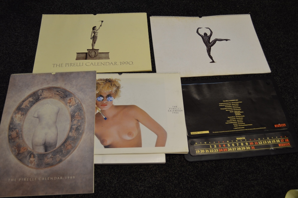 A group of nine Pirrelli calendars from the 1980's and 1990's