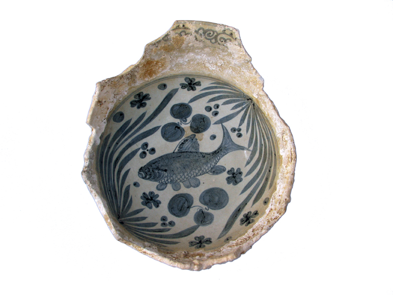 A Yuan period Chinese pottery Blue and White bowl decorated with a carp. Recovered from the coast of