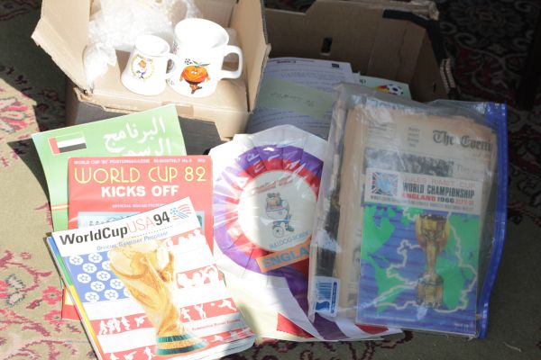 A collection of World Cup related items including programmes, ceramics etc from various World cups