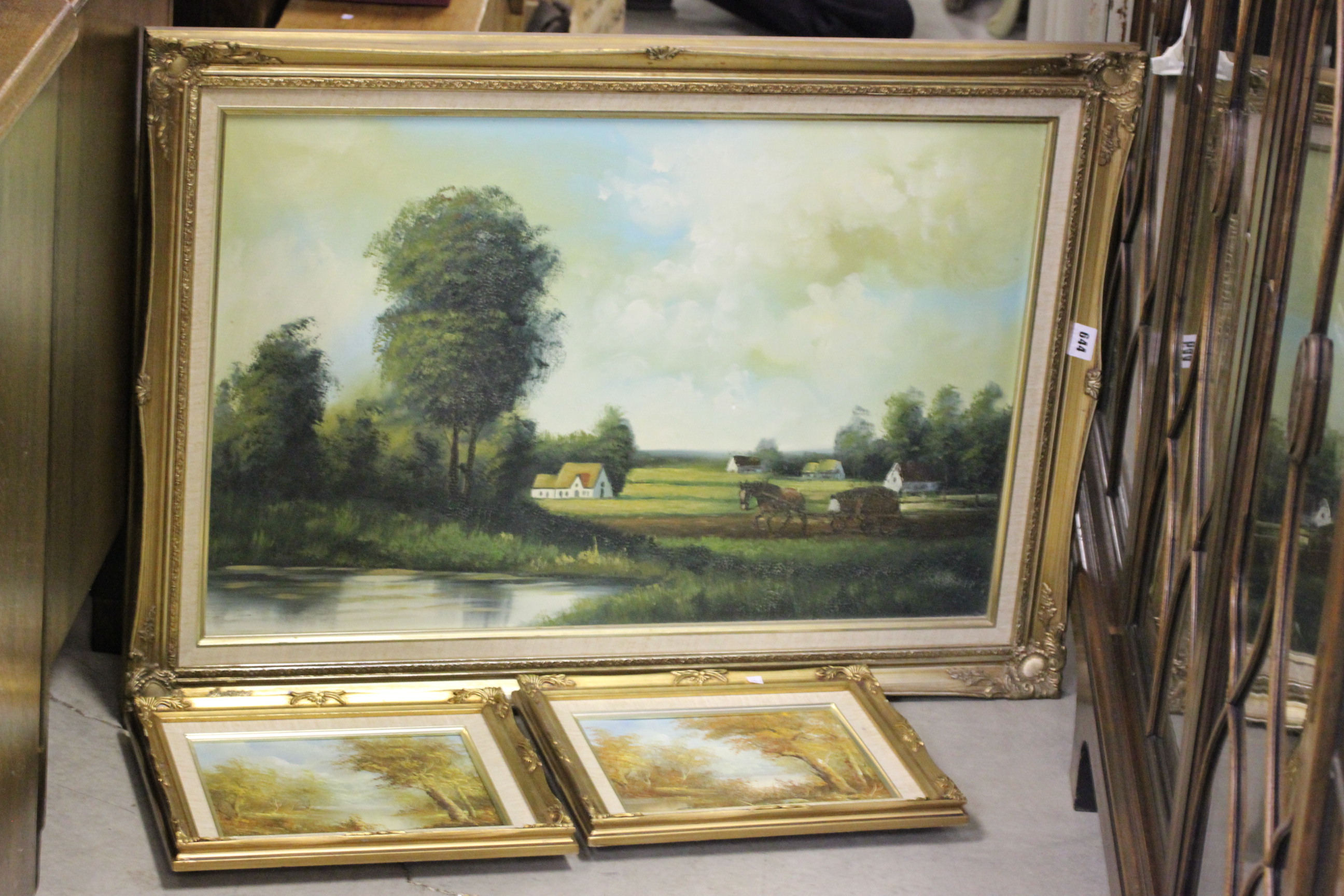 A Large Gilt Framed Oil of Horse Ploughing plus Two Oil Paintings of Lake and Woodland Scenes signed