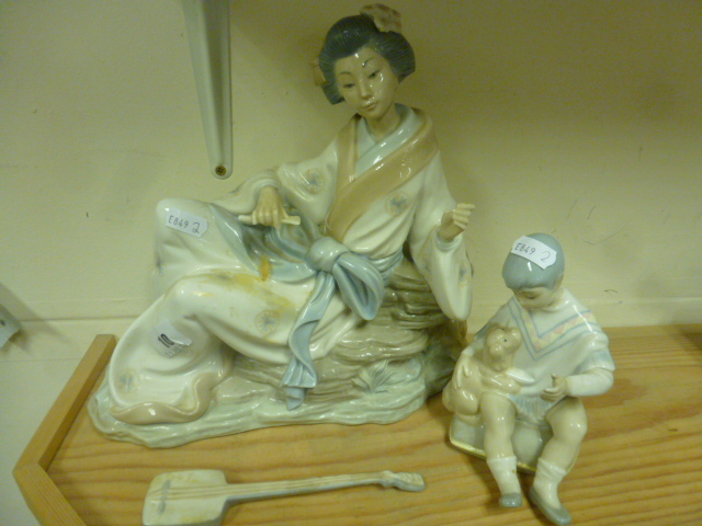 A Nao Figure of a Geisha Girl and a Similar Figure of a Boy with Puppy, unmarked