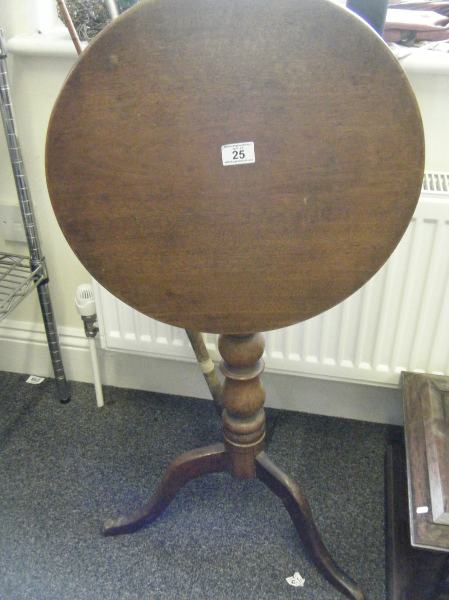 Georgian period tilt top table, circular top measuring 20" on tripod supports with turned centre