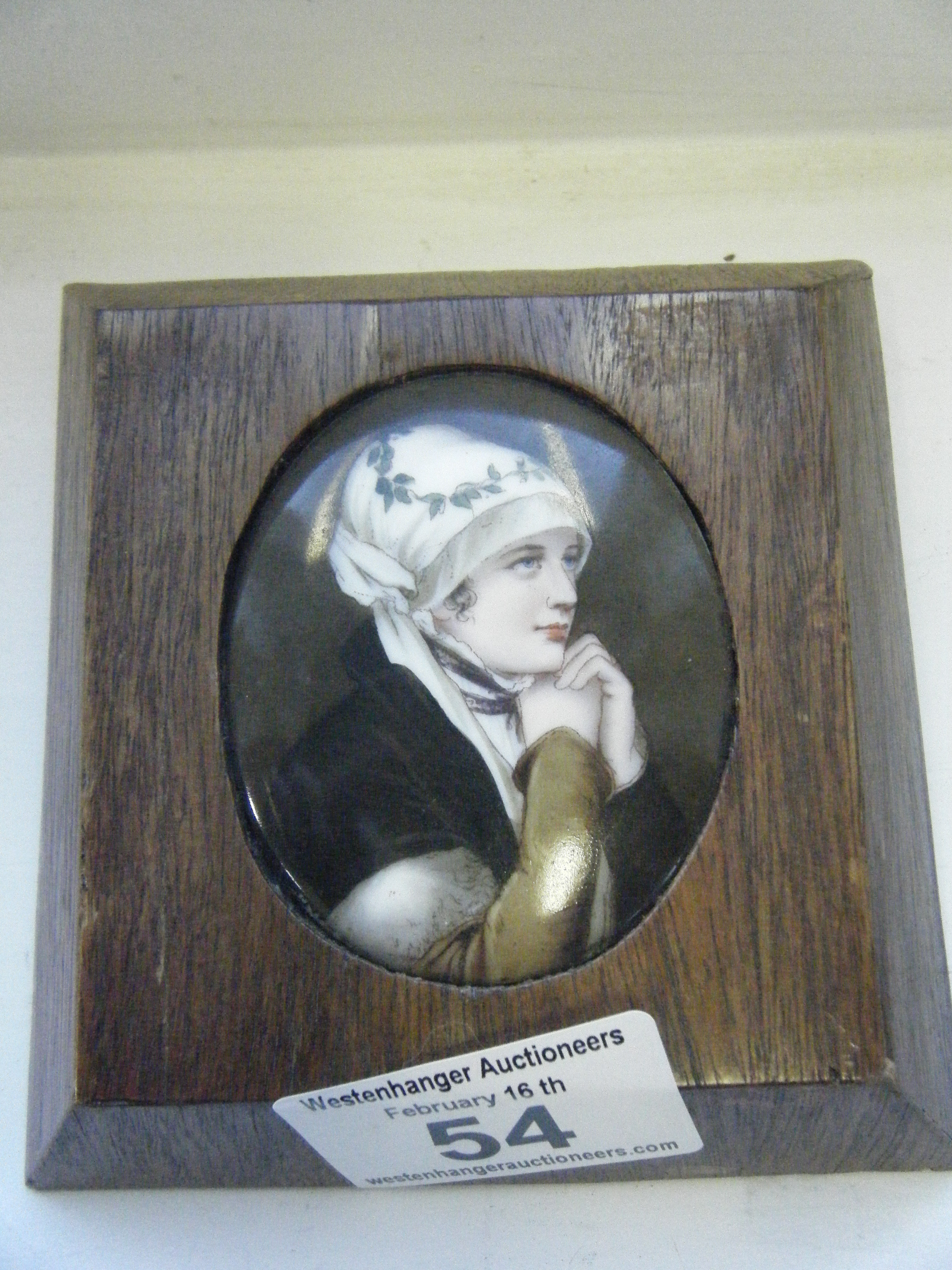 Antique framed miniature portrait on porcelain of a young Dutch? Girl in traditional dress, head and
