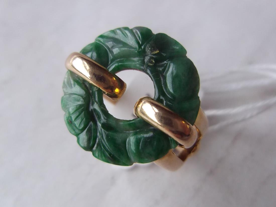 Carved jade circle ring in 14ct mount